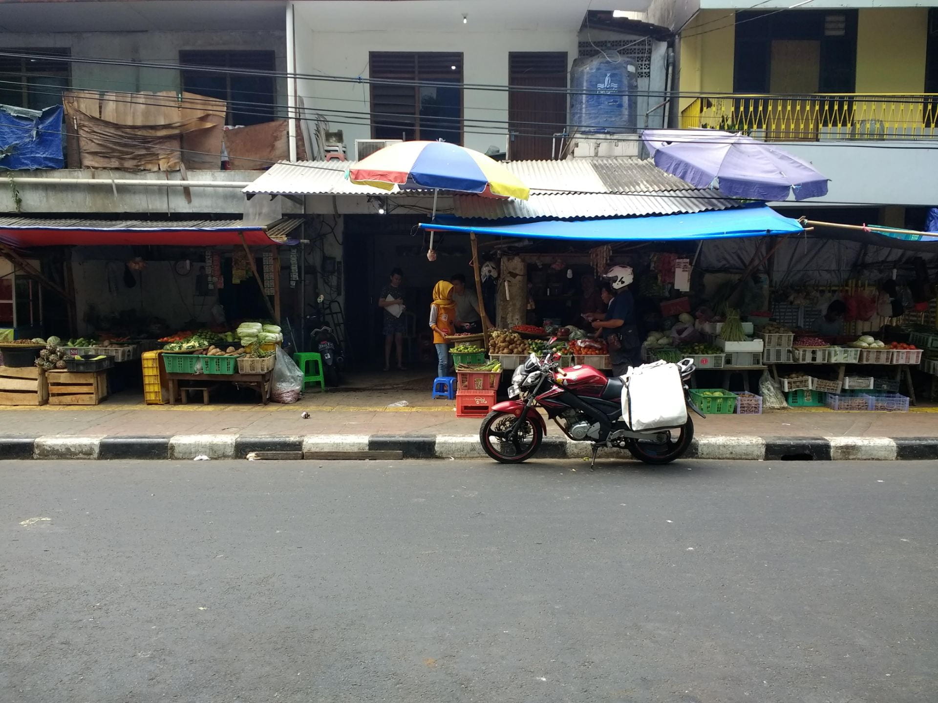 Food stalls on the side of a street 